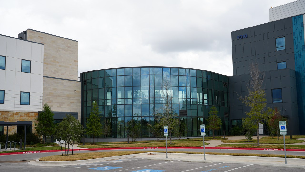 Dell Children's North Medical Center, a modern healthcare facility with a curved glass facade